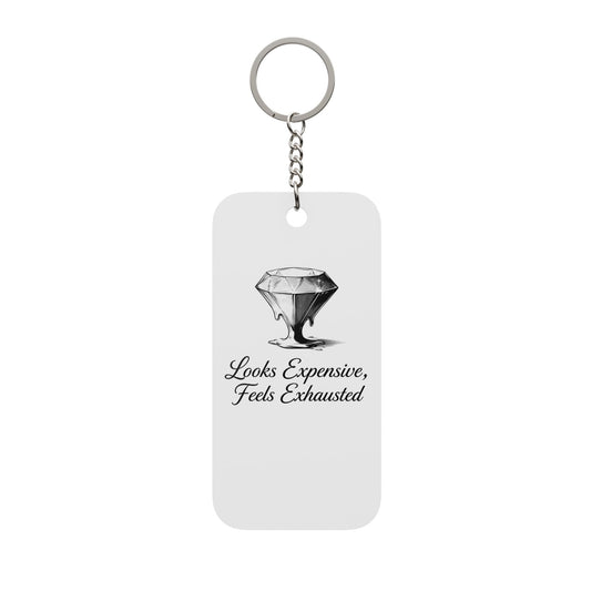 Keychain — “Looks Expensive, Feels Exhausted” Double-Sided Charm
